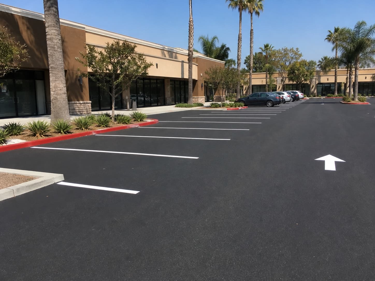 Illustrative iPhone-style view of a freshly paved and striped Southern California shopping center parking lot
